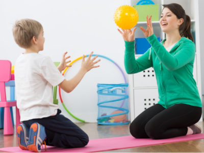 Boy catching ball with physio